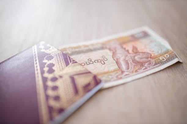 istock Fifty Burmese Kyats Bill Partially Inside a Sweden Passport 1286819663