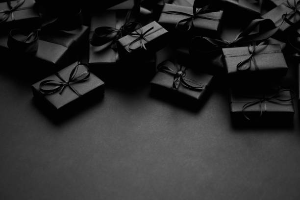 istock A pile various size black boxed gifts placed on stack. Christmas concept 1286819708