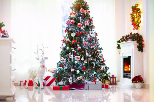 istock Decorated room with Christmas tree and fireplace 1286819712