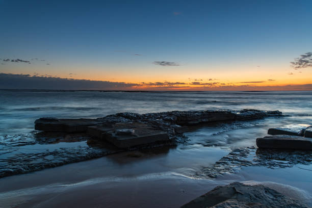 istock Rocky coastline sunrise seascape 1286823215
