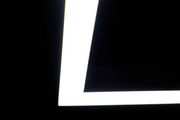 istock black and white asymmetrical striped background. white line light on black background 1286823220