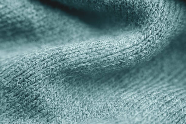 istock Close up of green knitted textured background. 1286824558