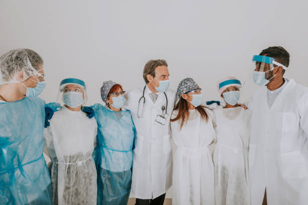 istock Covid-19 medical team with protection equipment 1286827994