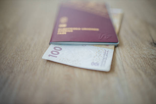istock 100 Moroccan Dirhams Bill Partially Inside a Sweden Passport 1286828276