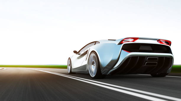 istock gray sportscar driving on a road 1286828407