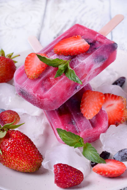 istock Berry popsicles with pieces of strawberry and honeysuckle 1286829683