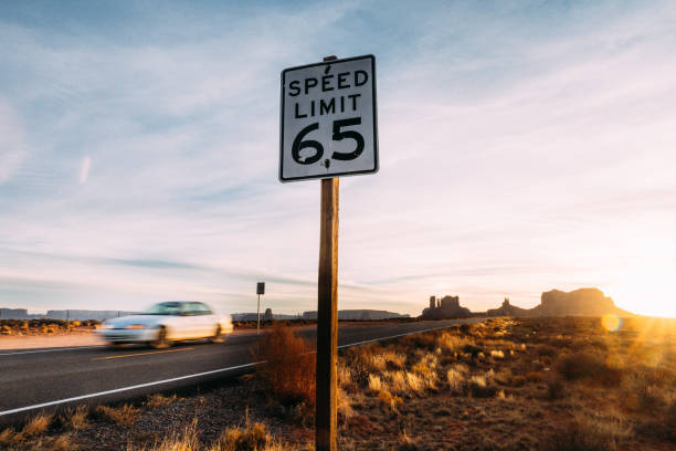 A Highway/Interstate in the Desert of Arizona on a Bright, Sunny Day with Mountains, Buttes, and Rock Formations in the Distance