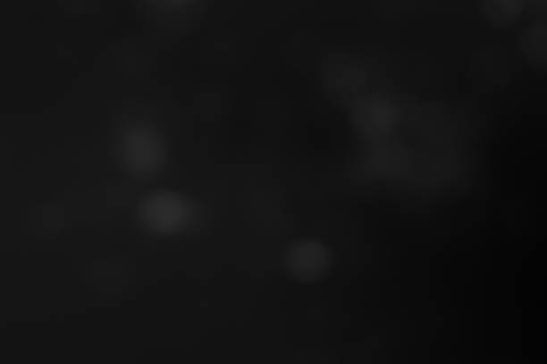 istock Dark blurred christmas lights background. Design effect focus happy holiday party glow texture black wallpaper bokeh sun sunny star shiny soft plain warm flare blur night light new year. 1286832335