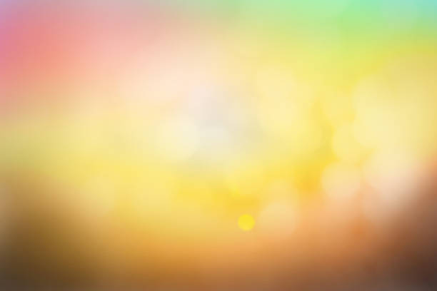 istock Hope concept; Abstract blurred sunrise background blurring warm colors calm bright sunlight. Sky effect gradient white sun at color orange light yellow soft flare patterns blur plain morning summer. 1286833329