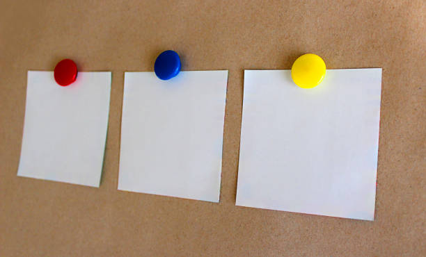 istock three white sheets of paper with magnets 1286833551