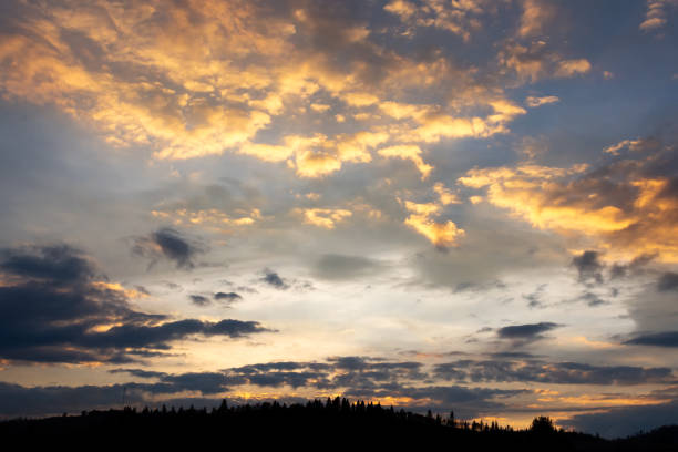istock Beautiful clouds at sunset over the mountains. Nature. 1286835868