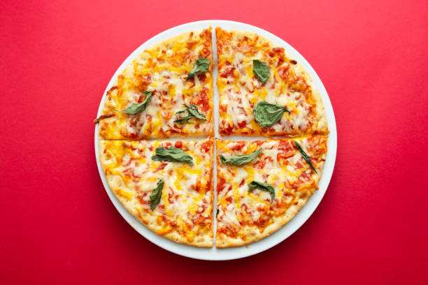 istock Classic cheese pizza over colourful red background with copy space. Fast food. 1286836738