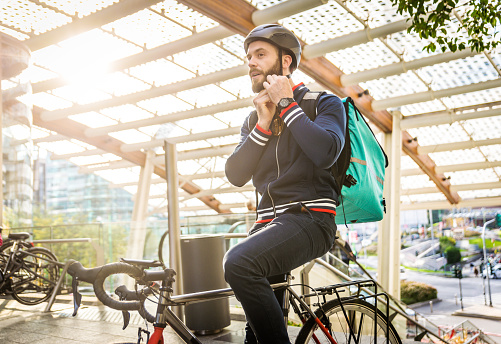 Food delivery service, rider delivering food to clints with bicycle - Concepts about transportation, food delivery and technology