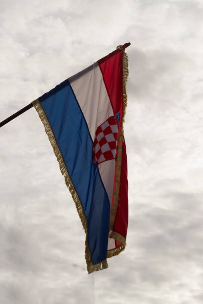 istock An image of croatian flag on a pole on cloudy day 1286836923