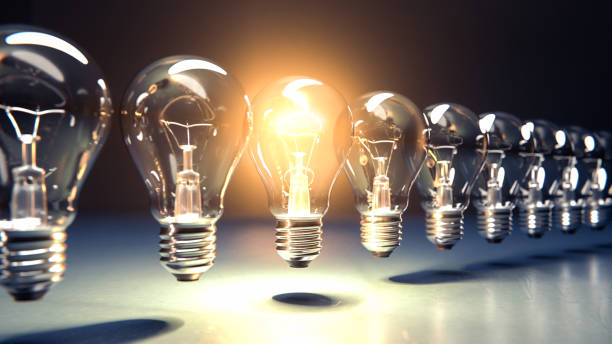 istock A row of lightbulbs with one brigthly lit - concept for having an idea, innovation, standing out. Diminshing perspective 1286837131