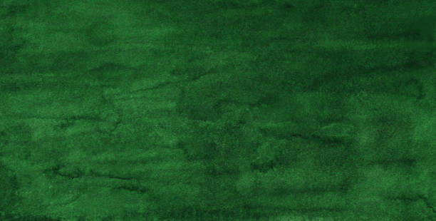 istock Watercolor green background texture painting. Watercolour abstract deep green backdrop. Stains on paper. 1286839761