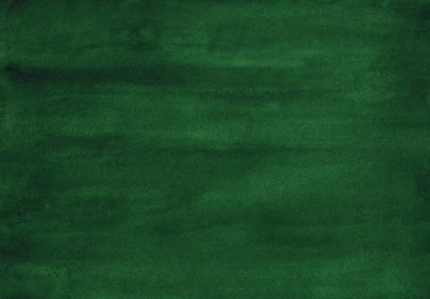 istock Watercolor deep green background texture painting. Watercolour abstract dark spruce backdrop. Stains on paper. 1286839765