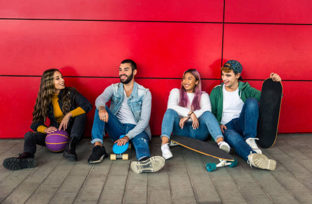istock Group of young students bonding outdoors 1286842392