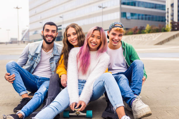 istock Group of young students bonding outdoors 1286842425
