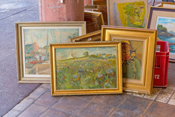 Cannes, France - February 1, 2016: Art Paintings for Sale at Antique Market in Cannes, France.