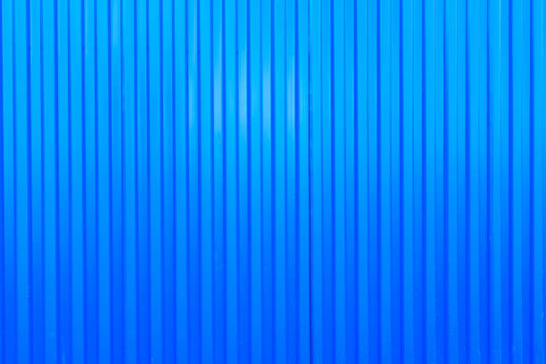 istock blue metal fence surface, corrugated sheet 1286842673