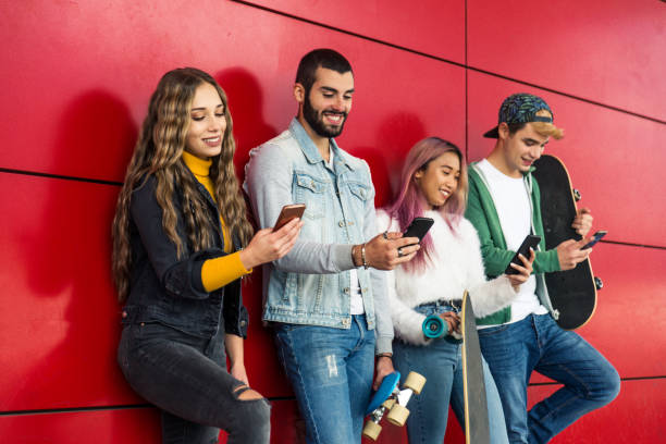 istock Group of young students bonding outdoors 1286842695