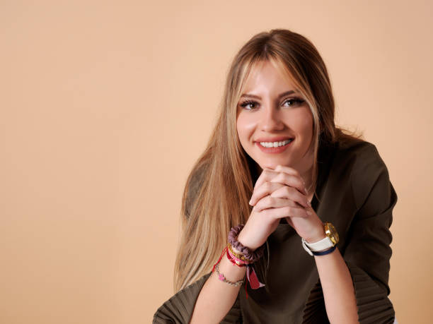 istock Pretty young woman leaning and smiling 1286842696