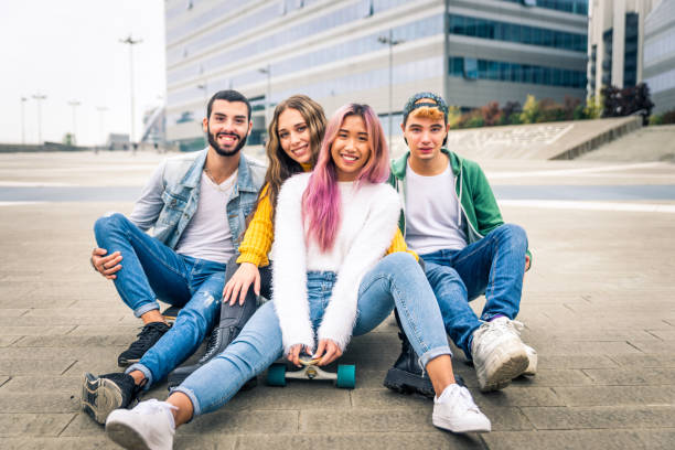 istock Group of young students bonding outdoors 1286842814