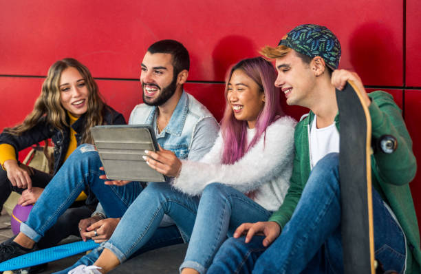 istock Group of young students bonding outdoors 1286842965