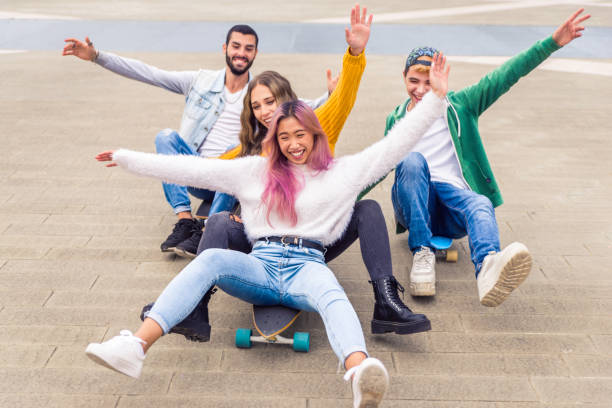 istock Group of young students bonding outdoors 1286843007