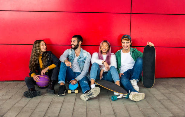 istock Group of young students bonding outdoors 1286843809