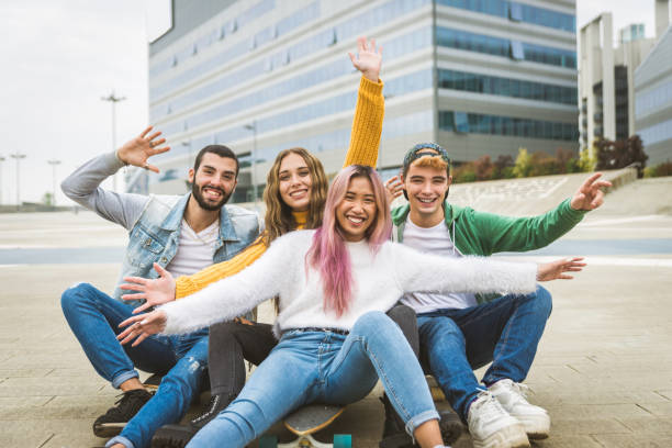 istock Group of young students bonding outdoors 1286843842