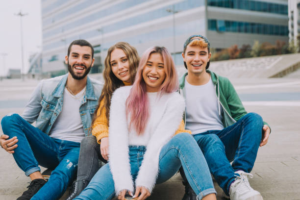 istock Group of young students bonding outdoors 1286843880