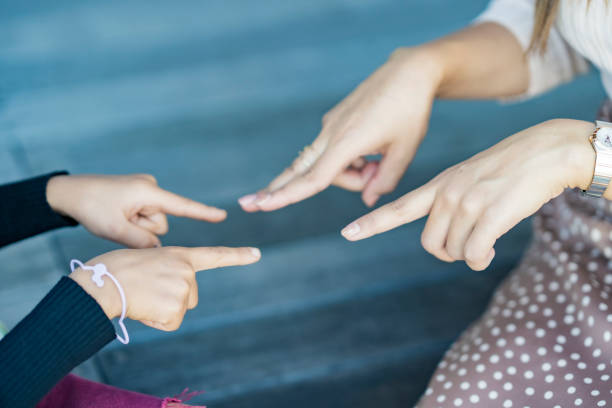 istock Mom and her kids playing by hand 1286843933