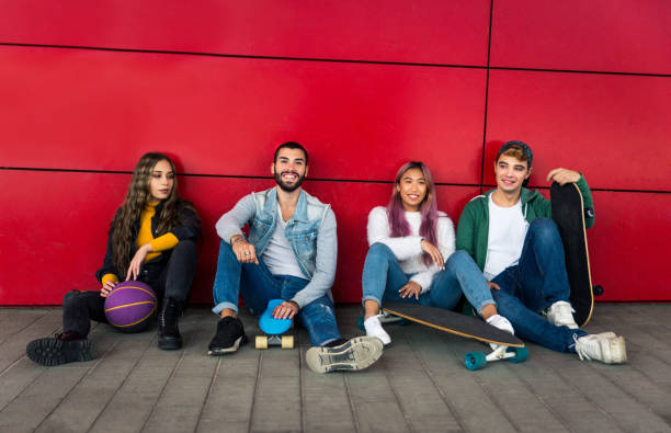 istock Group of young students bonding outdoors 1286843939