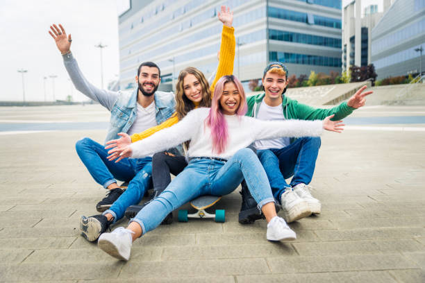 istock Group of young students bonding outdoors 1286844064