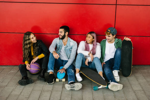 istock Group of young students bonding outdoors 1286844153