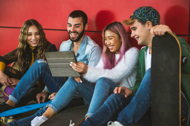 istock Group of young students bonding outdoors 1286844236