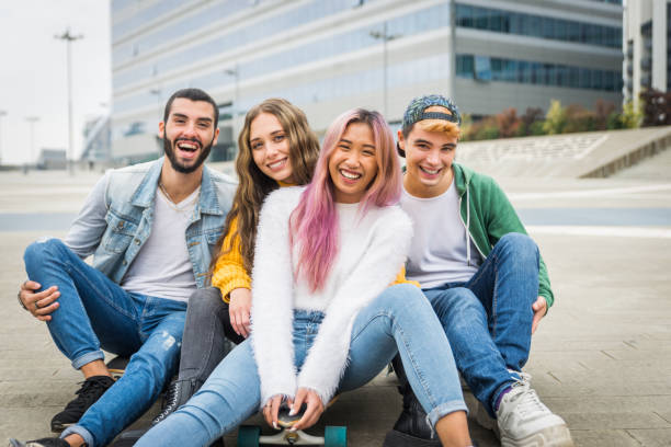 istock Group of young students bonding outdoors 1286844275