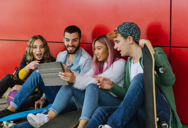 istock Group of young students bonding outdoors 1286844301
