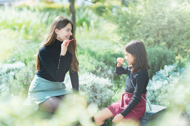 istock Mom and daughter brushing teeth 1286844434