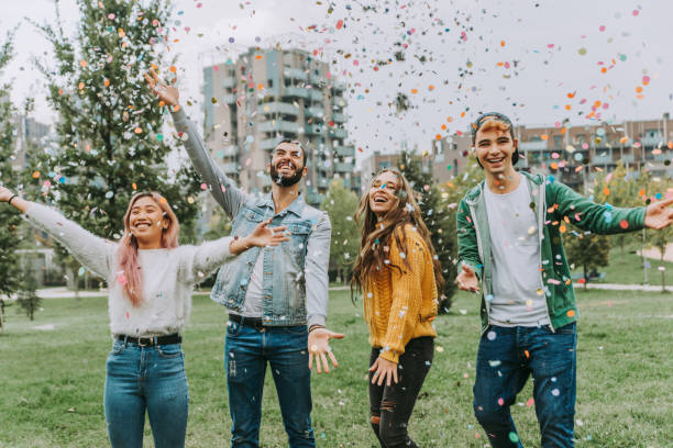 istock Group of young students bonding outdoors 1286845689