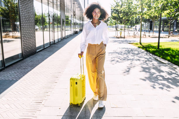 istock A beautiful woman with a suitcase outdoors 1286845744