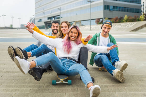 istock Group of young students bonding outdoors 1286845791