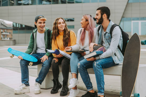 istock Group of young students bonding outdoors 1286845833