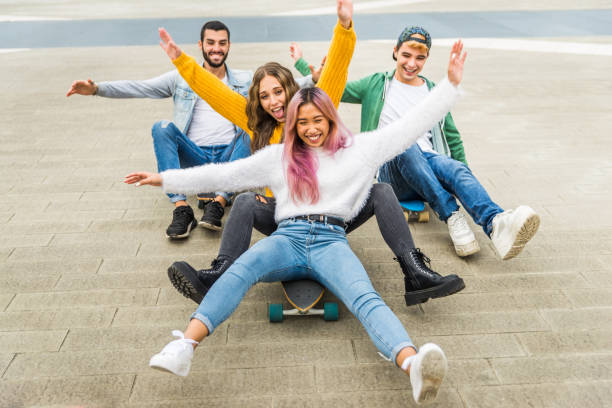 istock Group of young students bonding outdoors 1286845869
