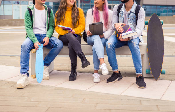 istock Group of young students bonding outdoors 1286845888
