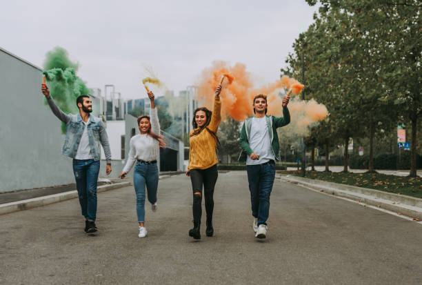 istock Group of young students bonding outdoors 1286846645