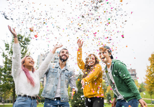 istock Group of young students bonding outdoors 1286846786