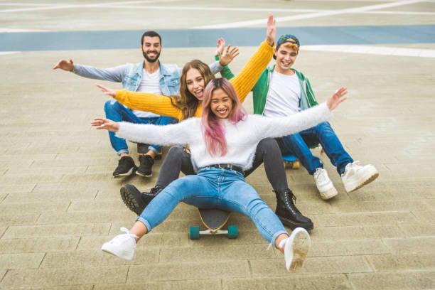 istock Group of young students bonding outdoors 1286846934